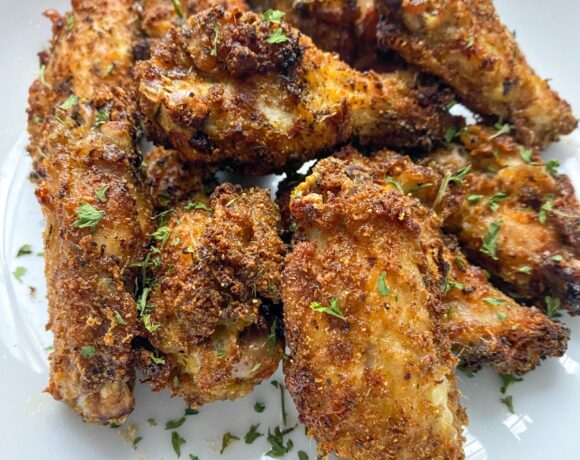 air fried chicken suya wings on a white plate