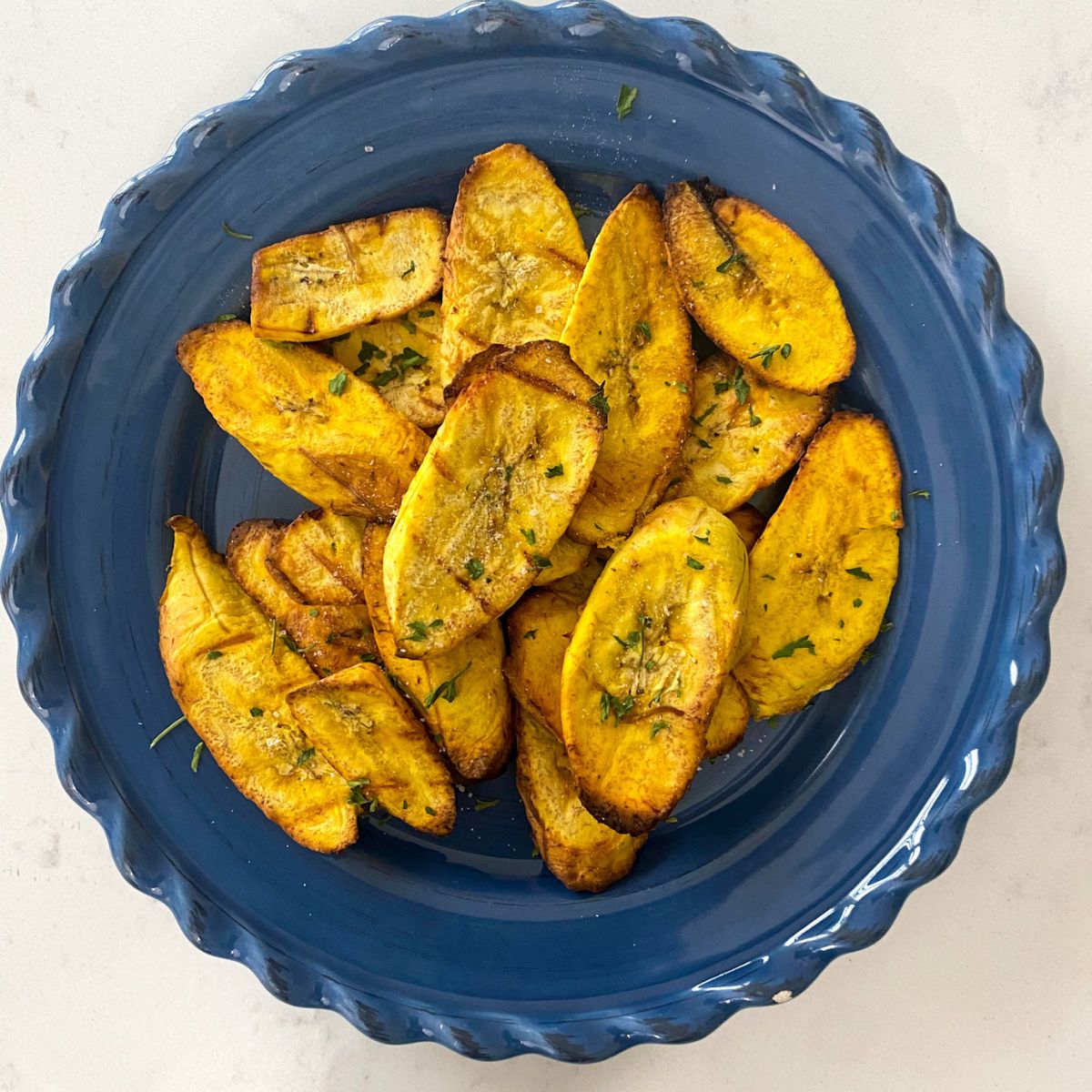 air fried plantains on a blue plate